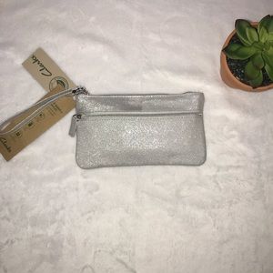 Silver metallic wristlet with portable battery